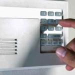 disarming alarm system --- Image by © Royalty-Free/Corbis